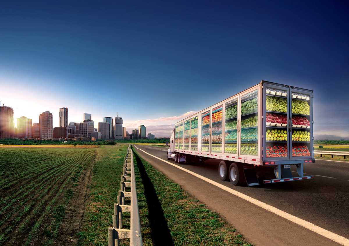 Temperature controlled truck driving towards a city.