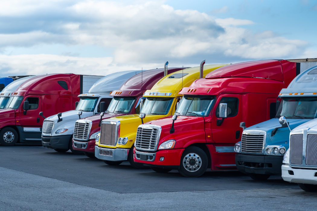 Trucks lined up in a parking lot.