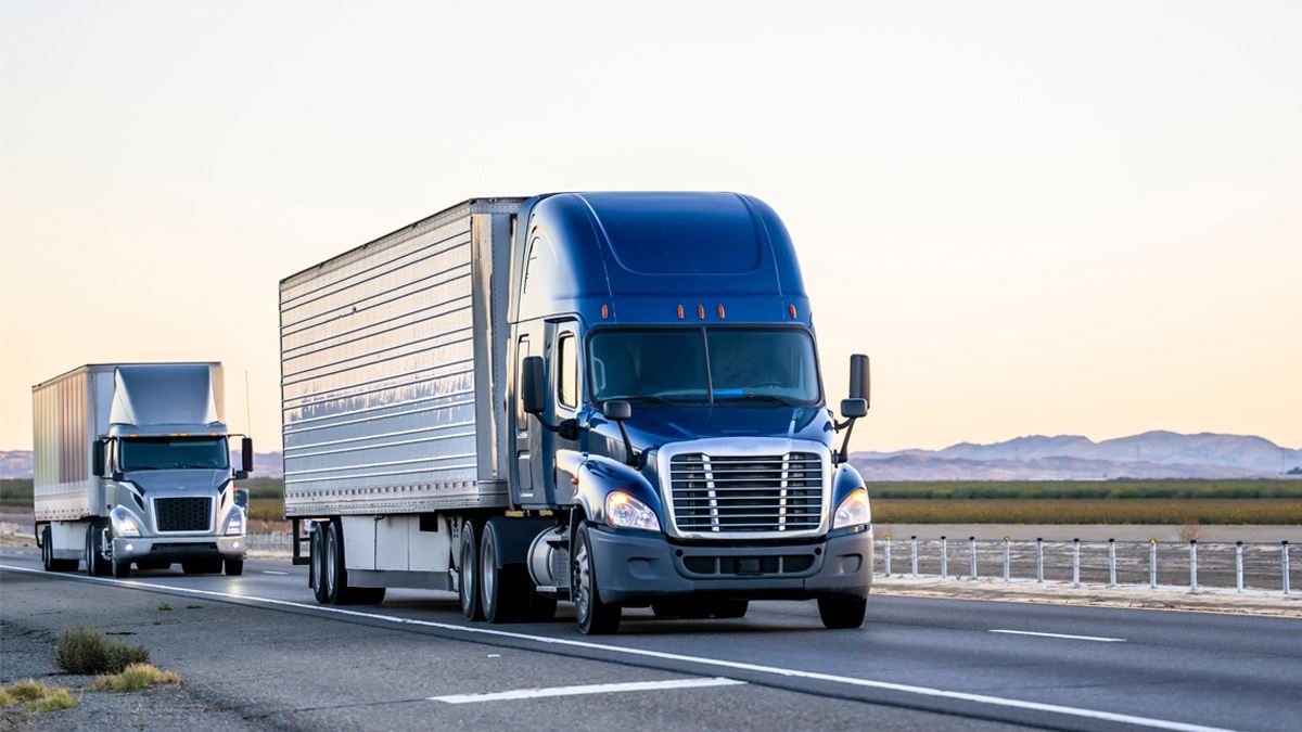 Blue truck driving on freeway